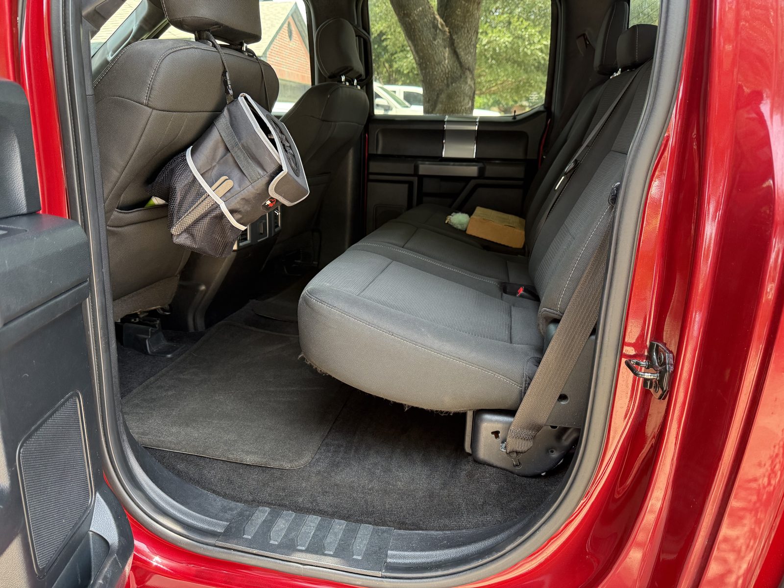 The same truck rear seats and carpet, vacuumed and spotless after detailing